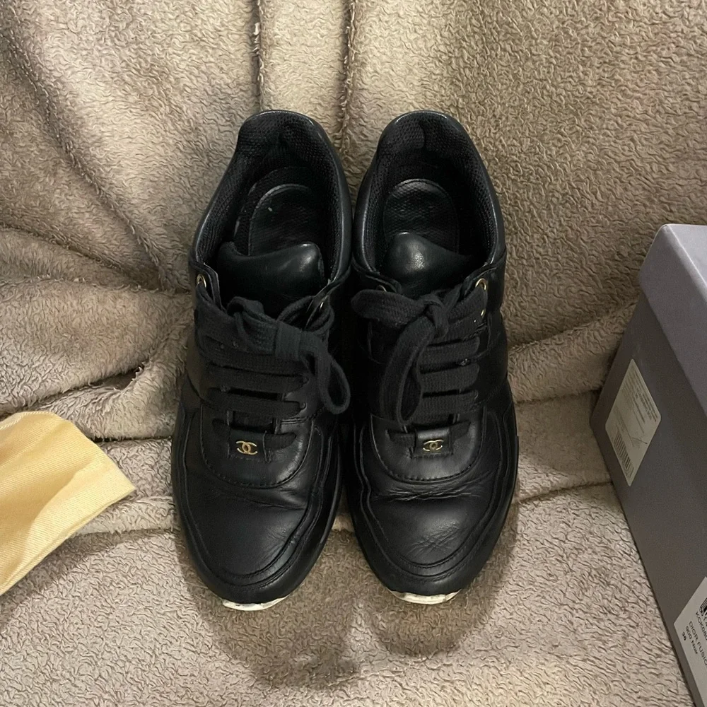 CHANEL Black Leather Low-Top Sneakers with White Accent